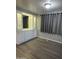 Living room with built-in storage and gray vinyl flooring at 120 N Val Vista Dr # 38, Mesa, AZ 85213