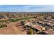 Aerial view of a luxury community featuring a golf course and Spanish-style homes at 12920 W Figueroa Dr, Sun City West, AZ 85375