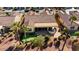 Backyard with putting green and covered patio at 12920 W Figueroa Dr, Sun City West, AZ 85375