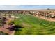 Golf course with surrounding homes and mountains in background at 12920 W Figueroa Dr, Sun City West, AZ 85375