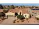 Aerial view of a beautiful single-story home with a two-car garage at 12920 W Figueroa Dr, Sun City West, AZ 85375