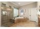 Spa-like bathroom with walk-in shower and soaking tub at 12920 W Figueroa Dr, Sun City West, AZ 85375