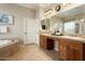 Elegant bathroom with double vanity and soaking tub at 12920 W Figueroa Dr, Sun City West, AZ 85375