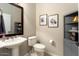 Powder room with pedestal sink and toilet at 12920 W Figueroa Dr, Sun City West, AZ 85375