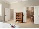 Bedroom with built-in shelves and en-suite bathroom at 12920 W Figueroa Dr, Sun City West, AZ 85375