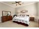 Bright bedroom with queen-size bed and dresser at 12920 W Figueroa Dr, Sun City West, AZ 85375