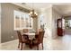 Charming breakfast nook with round table and access to backyard at 12920 W Figueroa Dr, Sun City West, AZ 85375