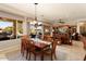 Spacious dining room featuring a large table and access to the kitchen at 12920 W Figueroa Dr, Sun City West, AZ 85375