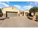 Exterior of the house showcasing a two-car garage and landscaping at 12920 W Figueroa Dr, Sun City West, AZ 85375