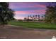 Stunning sunset view over the golf course and community at 12920 W Figueroa Dr, Sun City West, AZ 85375