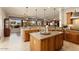 Open concept kitchen with large island and breakfast bar at 12920 W Figueroa Dr, Sun City West, AZ 85375
