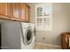 Laundry room with washer, dryer, and cabinets at 12920 W Figueroa Dr, Sun City West, AZ 85375