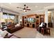 Spacious living area with a large built-in entertainment center and comfortable seating at 12920 W Figueroa Dr, Sun City West, AZ 85375