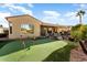 Private backyard putting green, perfect for golf enthusiasts at 12920 W Figueroa Dr, Sun City West, AZ 85375