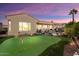 Private putting green in the backyard with sunset views at 12920 W Figueroa Dr, Sun City West, AZ 85375