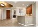 Home bar with granite countertop and wine cooler at 12920 W Figueroa Dr, Sun City West, AZ 85375