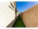 Side yard with artificial turf and brick wall at 1329 N Balboa --, Mesa, AZ 85205