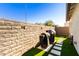 Backyard with artificial turf and two grills at 1329 N Balboa --, Mesa, AZ 85205