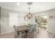 Farmhouse style dining room with wooden table and sliding glass door at 1329 N Balboa --, Mesa, AZ 85205