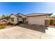 Single-story home with a two-car garage and landscaped front yard at 1329 N Balboa --, Mesa, AZ 85205