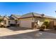 Single-story home with a two-car garage and side yard view at 1329 N Balboa --, Mesa, AZ 85205