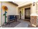 Inviting front entry with a charming bench and sunflower decor at 1329 N Balboa --, Mesa, AZ 85205