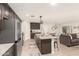 Open concept kitchen with island, stainless steel appliances, and granite countertops at 1329 N Balboa --, Mesa, AZ 85205