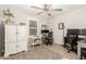 Home office with two desks, a chair, and ample lighting at 1329 N Balboa --, Mesa, AZ 85205