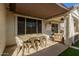 Patio dining area with seating for six under a shade at 1329 N Balboa --, Mesa, AZ 85205