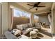 Relaxing covered patio with seating area and fans at 1329 N Balboa --, Mesa, AZ 85205