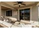 Covered patio with sliding glass doors and seating at 1329 N Balboa --, Mesa, AZ 85205
