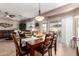 Dining area with wooden table and chairs near sliding door at 1410 E Palm Beach Dr, Chandler, AZ 85249