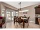 Dining area with wooden table and access to backyard at 1410 E Palm Beach Dr, Chandler, AZ 85249