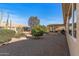 View of backyard, showing patio, landscaping, and trees at 14722 W Arzon Way, Sun City West, AZ 85375