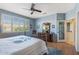 Main bedroom with a dresser and a view of the bathroom and closet at 14722 W Arzon Way, Sun City West, AZ 85375