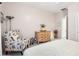 Bedroom with a comfortable chair and ample closet space at 15107 W Las Brizas Ln, Sun City West, AZ 85375