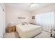 Spacious bedroom with a king-size bed and window coverings at 15107 W Las Brizas Ln, Sun City West, AZ 85375