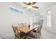 Charming dining room with wood table and six chairs at 15107 W Las Brizas Ln, Sun City West, AZ 85375