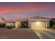 Single-story home with tile roof, attached garage, and desert landscaping at 15107 W Las Brizas Ln, Sun City West, AZ 85375
