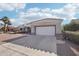 Single-story home with tile roof, attached garage, and desert landscaping at 15107 W Las Brizas Ln, Sun City West, AZ 85375