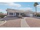 Single-story home with tile roof, attached garage, and landscaped walkway at 15107 W Las Brizas Ln, Sun City West, AZ 85375