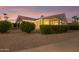 Backyard view showcasing landscaping and covered patio area at 15107 W Las Brizas Ln, Sun City West, AZ 85375