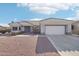 Single-story home with tile roof, attached garage, and desert landscaping at 15107 W Las Brizas Ln, Sun City West, AZ 85375