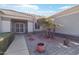 Landscaped front yard with paved pathway leading to entrance at 15107 W Las Brizas Ln, Sun City West, AZ 85375