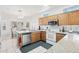 Spacious kitchen, granite countertops, and stainless steel appliances at 15107 W Las Brizas Ln, Sun City West, AZ 85375