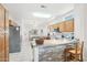 Well-equipped kitchen with granite counters and wood cabinets at 15107 W Las Brizas Ln, Sun City West, AZ 85375