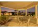 Covered patio with seating area, offering a relaxing outdoor space at 15107 W Las Brizas Ln, Sun City West, AZ 85375