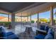 Covered patio with seating area, offering a relaxing outdoor space at 15107 W Las Brizas Ln, Sun City West, AZ 85375