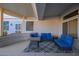Covered patio furnished with comfortable seating and a rug at 15107 W Las Brizas Ln, Sun City West, AZ 85375