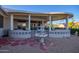 Outdoor patio with fountain and red stone pathway at 15107 W Las Brizas Ln, Sun City West, AZ 85375